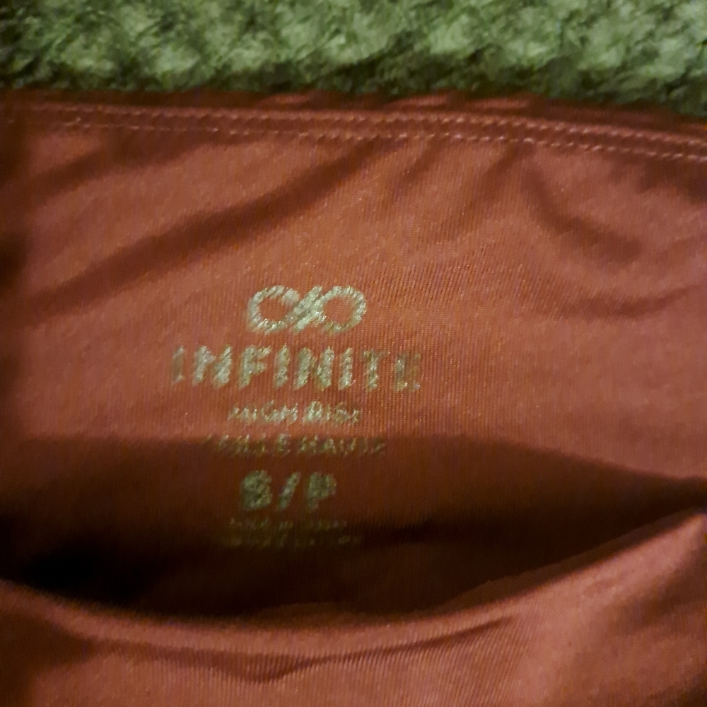 Women's Infiniti burgundy tights. Size small